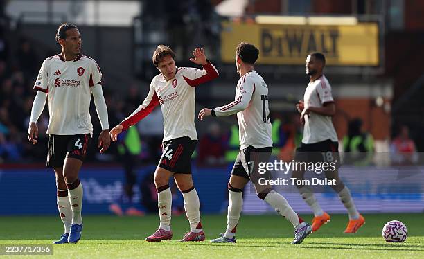 Federico Chiesa of Liverpool celebrates scoring his team's first goal with teammate Curtis Jones during the Premier League match between Crystal...