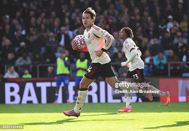 Federico Chiesa of Liverpool runs back with the ball after scoring his team's first goal during the Premier League match between Crystal Palace and...