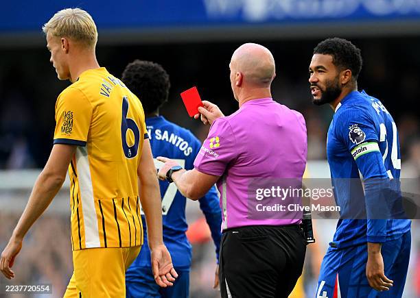 Reece James of Chelsea reacts to referee Simon Hooper showing a red card to Trevoh Chalobah of Chelsea during the Premier League match between...