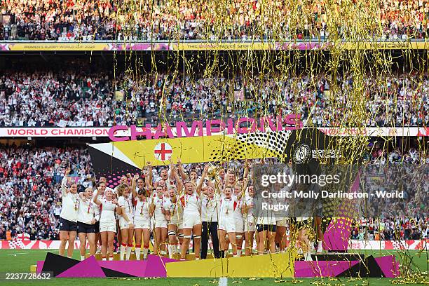 Zoe Aldcroft and Megan Jones of England lift the Women's Rugby World Cup trophy following victory in the Women's Rugby World Cup 2025 Final match...