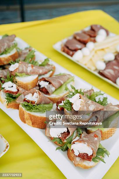 catering platter with gourmet appetizers and charcuterie board - crab stick stock pictures, royalty-free photos & images