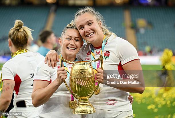 Natasha Hunt and Zoe Aldcroft of England pose for a photo with the trophy as they celebrate victory following the Women's Rugby World Cup 2025 Final...