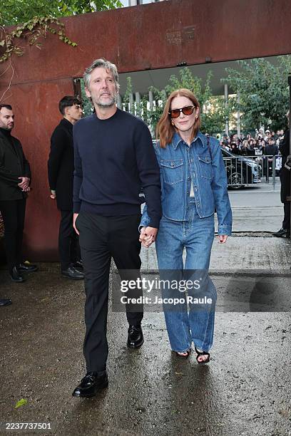 Bart Freundlich and Julianne Moore are seen arriving at the Bottega Veneta Summer 26 fashion show during the Milan Fashion Week Spring/Summer 2026 on...
