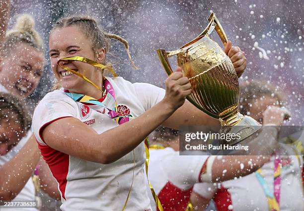 Zoe Aldcroft of England celebrates with the World Cup Trophy after winning the Women's Rugby World Cup 2025 Final match between Canada and England at...