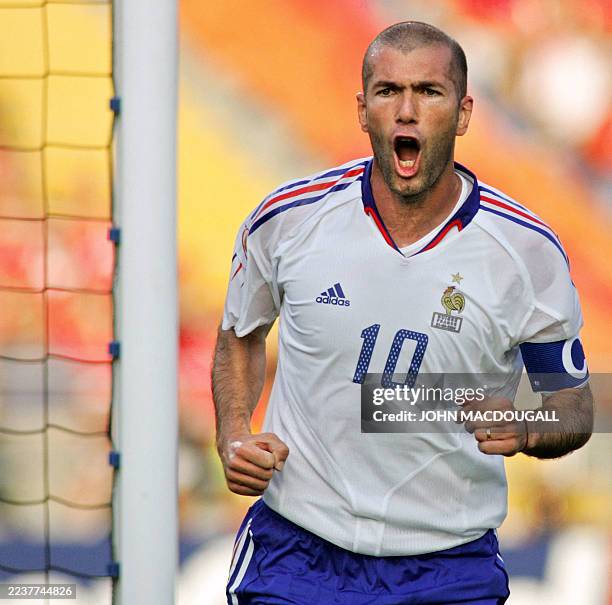 French midfielder and captain Zinedine Zidane jubilates after his goal, 21 June 2004 at Coimbra's stadium, during the Euro 2004 group B football...