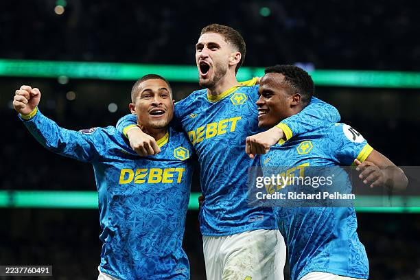 Santiago Bueno of Wolverhampton Wanderers celebrates scoring his team's first goal with teammates Joao Gomes and Jhon Arias during the Premier League...