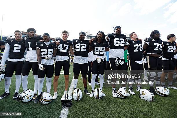 The Vanderbilt Commodores celebrate after a 55-35 victory against the Utah State Aggies at FirstBank Stadium on September 27, 2025 in Nashville,...