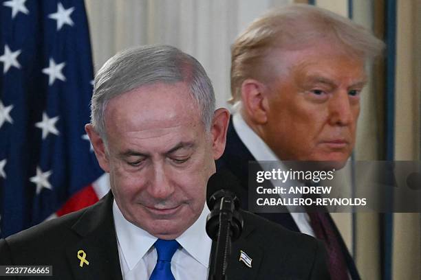 President Donald Trump and Israeli Prime Minister Benjamin Netanyahu arrive for a press conference in the State Dining Room of the White House in...