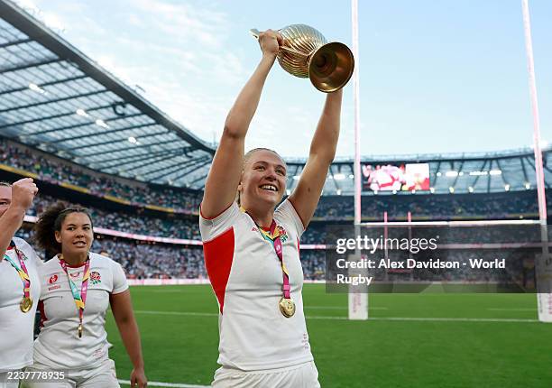 Zoe Aldcroft of England carries the trophy after the Women's Rugby World Cup 2025 Final match between Canada and England at Allianz Stadium on...
