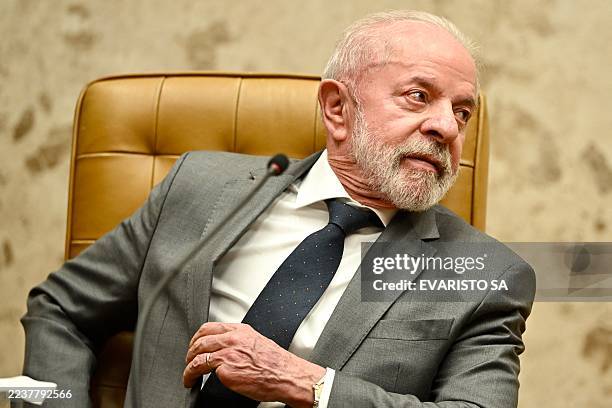 Brazil's President Luiz Inacio Lula da Silva gestures during a ceremony where Judge Edson Fachin took office as Chief Justice and Alexandre de Moraes...
