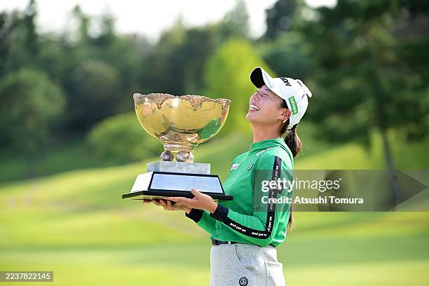 Fuka Suga of Japan poses with the trophy after winning the tournament following the final round of 52nd Miyagi TV Cup Dunlop Ladies Open Golf...