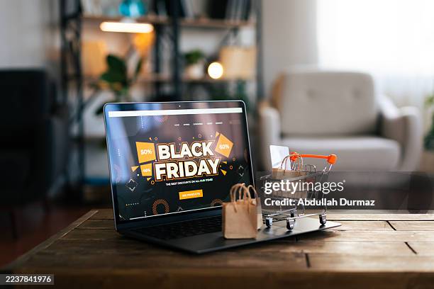 online shopping on laptop during black friday sales - black friday bildbanksfoton och bilder