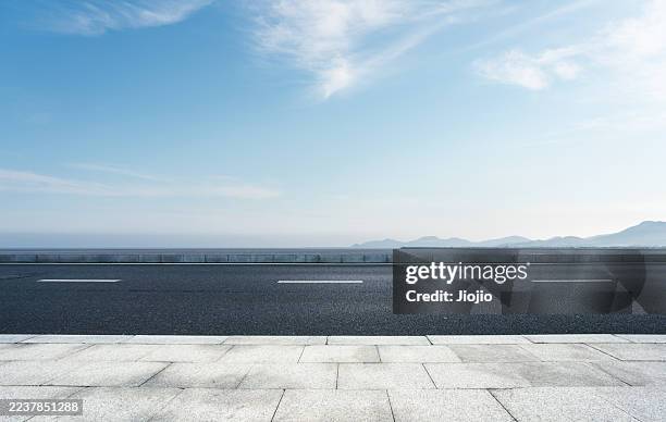 empty road against sky - roadside stock pictures, royalty-free photos & images