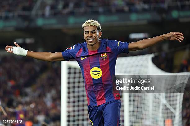 Lamine Yamal of FC Barcelona celebrates his teams second goal scored by Robert Lewandowski of FC Barcelona during the LaLiga EA Sports match between...