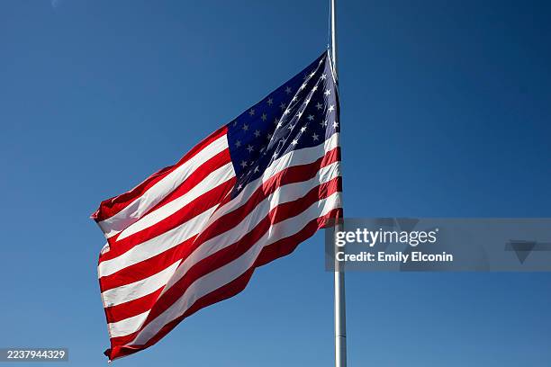 Flag flies at half mast following a shooting and fire at the Church of Jesus Christ of Latter-day Saints Michigan, on September 30, 2025 in Grand...