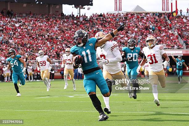 Parker Washington of the Jacksonville Jaguars returns a punt for a touchdown against the San Francisco 49ers during the third quarter at Levi's...