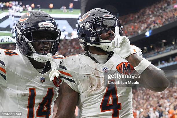 Andre Swift celebrates a fourth quarter touchdown against the Las Vegas Raiders with Olamide Zaccheaus of the Chicago Bears at Allegiant Stadium on...