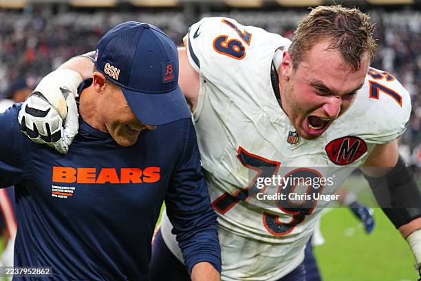 Head coach Ben Johnson and Theo Benedet of the Chicago Bears celebrate after beating the Las Vegas Raiders 25-24 at Allegiant Stadium on September...