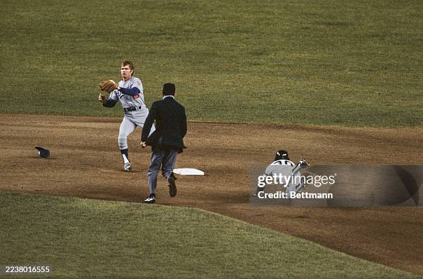 The Los Angeles Dodgers' Bill Russell prevents the Yankees' Willie Randolph from stealing second base in the first inning of game 6 of the World...