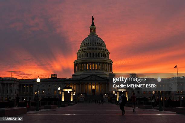 View of the U.S. Capitol is seen at sunset on September 30 in Washington, DC. Lawmakers face a looming deadline to reach a bipartisan funding...