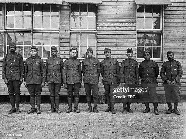 United States Army NCO's JH Jones, R Flower, CE Davis, J White, JH Carmen, SC Farrell, B Lucas, HL Printer and EN Barrington of the 369th Infantry...
