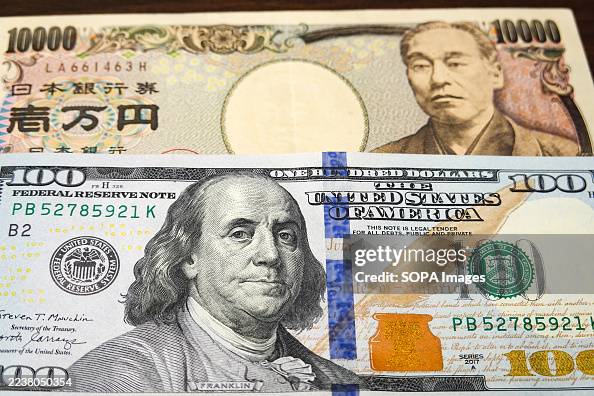 In this photo illustration, a 100 dollar bill seen displayed In this photo illustration, a 100 dollar bill seen displayed