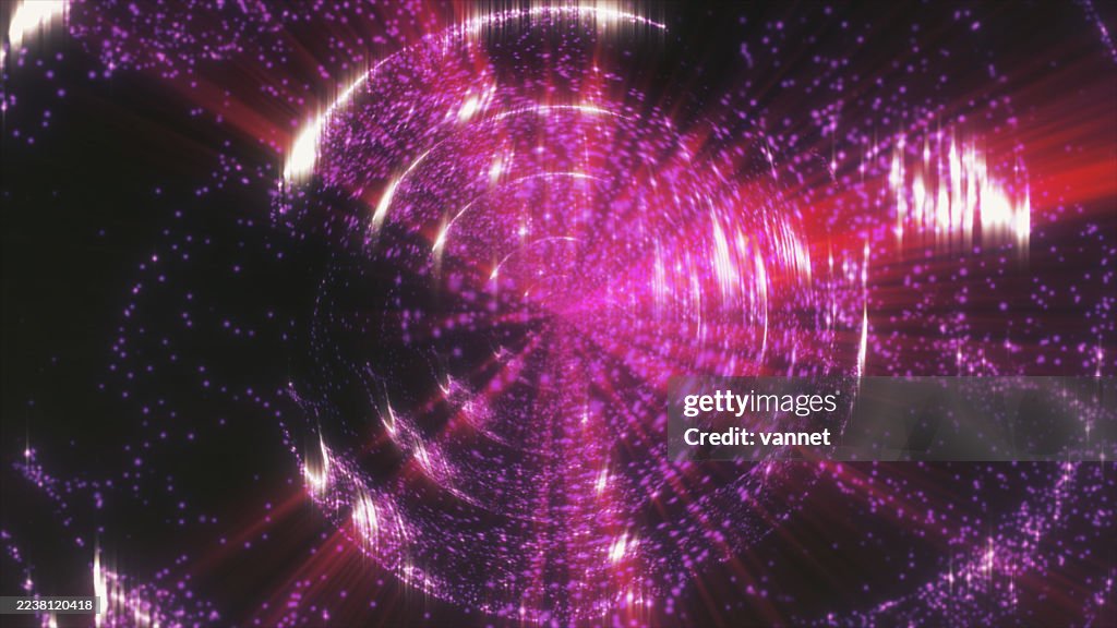 Kaleidoscope in fantasy shapes of rays and red and pink particles