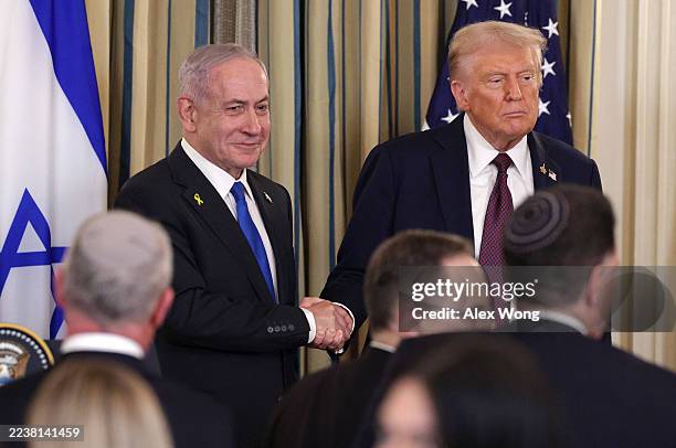 President Donald Trump shakes hands with Israeli Prime Minister Benjamin Netanyahu at the end of a joint news conference in the State Dining Room at...