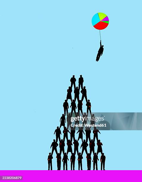silhouettes forming teamwork pyramid with one figure reaching success - environmental challenges stock illustrations