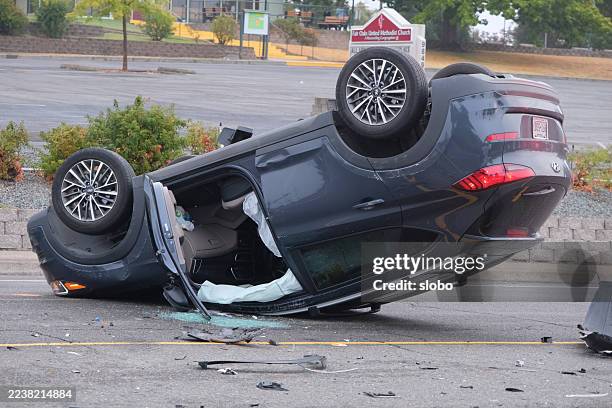 flipped car in an accident - road accident stock pictures, royalty-free photos & images