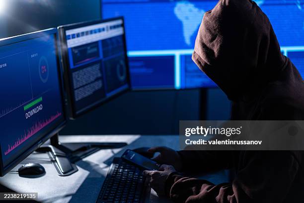 computer hacker stealing data concept for network security, identity theft and computer crime - fugitive stock pictures, royalty-free photos & images