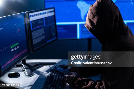 Computer hacker stealing data concept for network security, identity theft and computer crime Computer hacker stealing data concept for network security, identity theft and computer crime