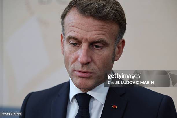 France's President Emmanuel Macron looks down as he speaks to the press at the end of the 7th European Political Community Summit at the Bella Center...