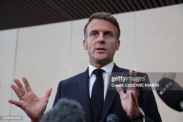 France's President Emmanuel Macron gestures as he speaks to the press at the end of the 7th European Political Community Summit at the Bella Center...