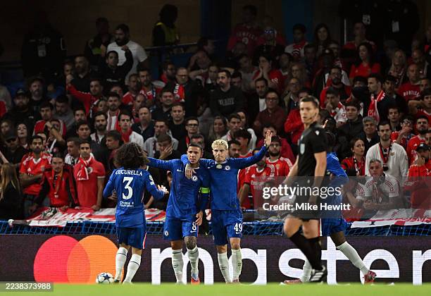Marc Cucurella, Enzo Fernandez and Alejandro Garnacho of Chelsea celebrate after Richard Rios of Benfica scored an own goal and Chelsea's first goal...