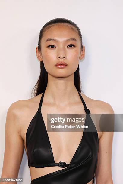 Model, beauty detail, poses backstage prior to the Anrealage Womenswear Spring/Summer 2026 show as part of Paris Fashion Week on September 30, 2025...