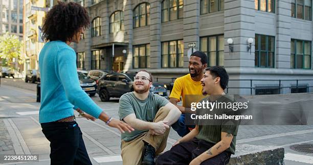 four best friends hanging out on a sidewalk in brooklyn - alleen jonge mannen stockfoto's en -beelden