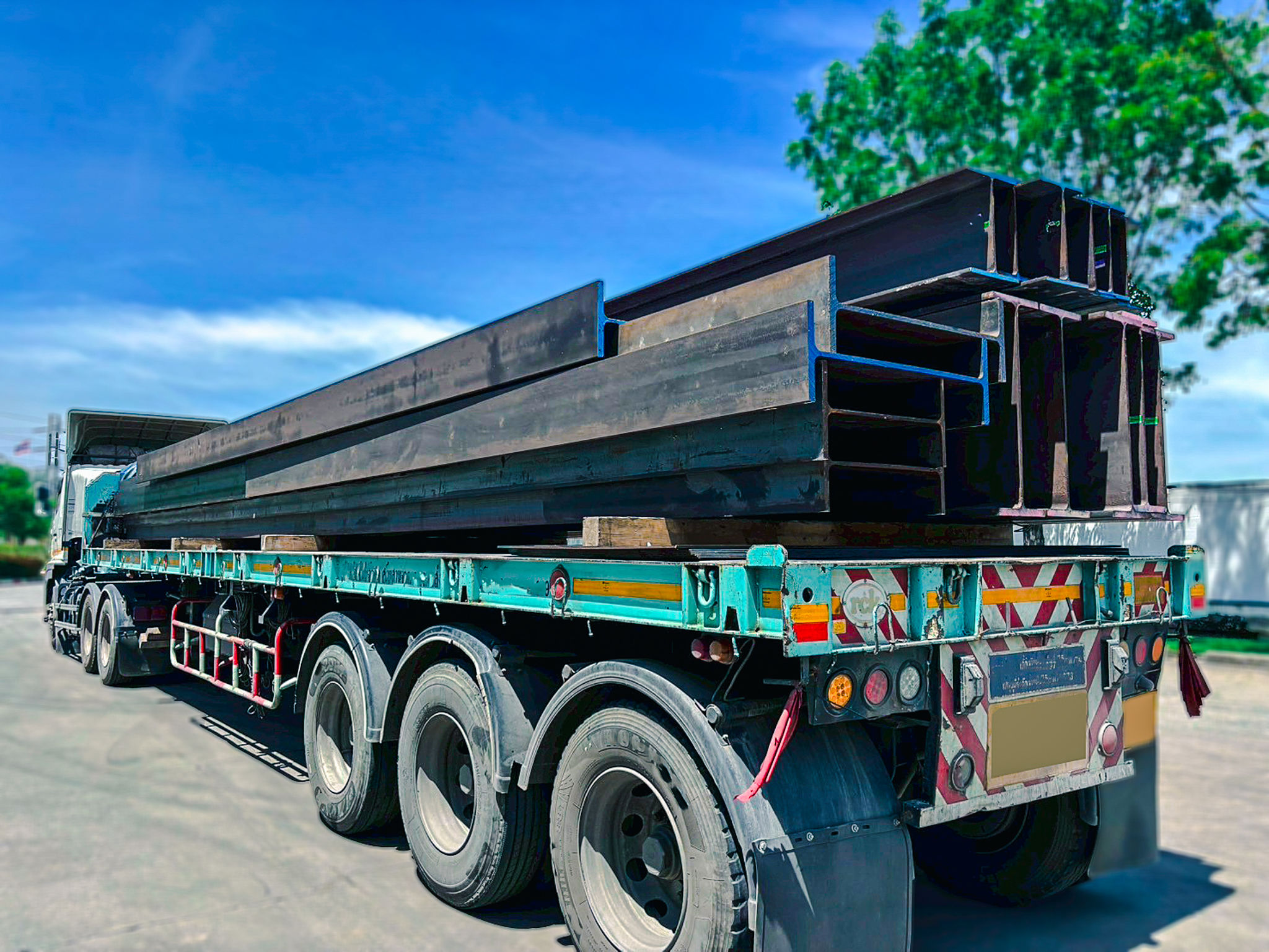 Wide flange steel beams arranged in a construction yard, essential for heavy-duty structural frameworks. Commonly used in industrial buildings, bridges, and high-rise projects for strength. Wide flange steel beams arranged in a construction yard, essential for heavy-duty structural frameworks. Commonly used in industrial buildings, bridges, and high-rise projects for strength.