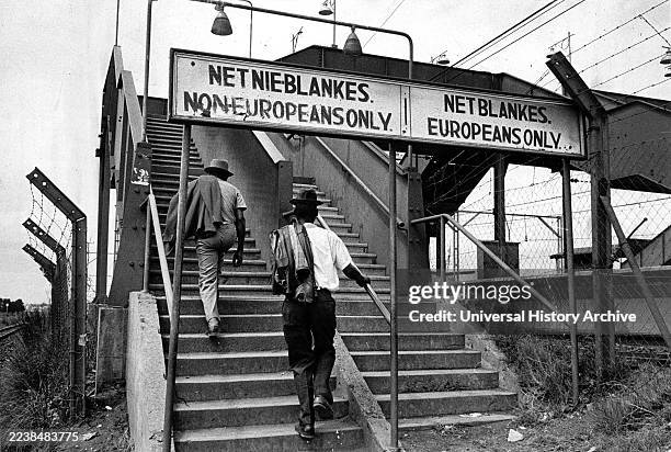 Sign showing segregation under the Apartheid laws in South Africa. 1975. Photograph of segregational signs at a South African train station..