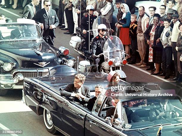 Jackie and John F Kennedy in the limousine , during the ride through Dallas Texas where John Kennedy was assassinated. 1963.