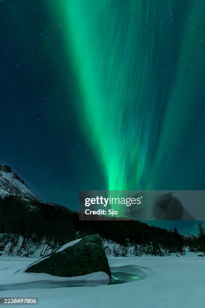 northern lights, aurora borealis over the lofoten islands in northern norway during winter - lofoten islands stock pictures, royalty-free photos & images