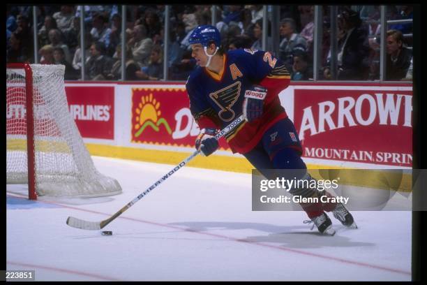 Defenseman Al MacInnis of the St. Louis Blues moves down the ice during a game against the Anaheim Mighty Ducks at Arrowhead Pond in Anaheim,...