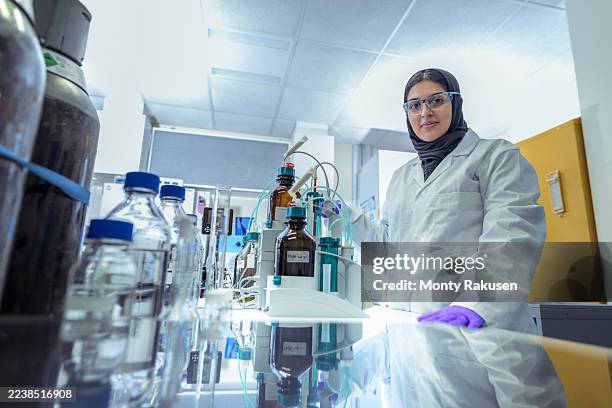 scientist working with a titration machine in experimental crystal laboratory - titration stock pictures, royalty-free photos & images