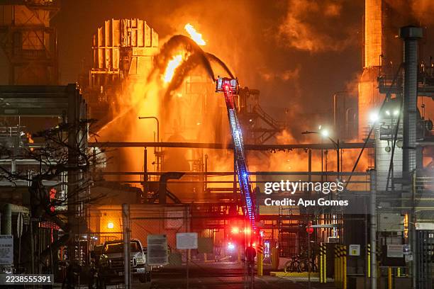 Fire burns at a Chevron refinery on October 3, 2025 in El Segundo, California. A big explosion around 10 pm on October 2, producing a large orange...