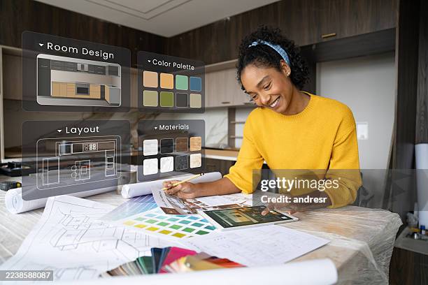 interior designer remodeling a kitchen and using interactive screens while working - interior designer stock pictures, royalty-free photos & images