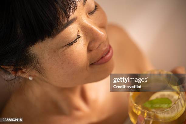 relaxing bath - asian drinking tea stock pictures, royalty-free photos & images