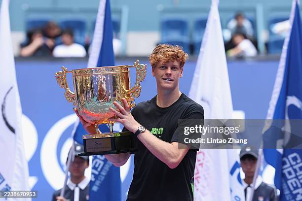 Jannik Sinner of Italy poses with his trophy during medal ceremony after winning the Men's Singles final match against Learner Tien of the United...