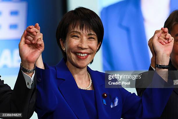 Newly-elected Liberal Democratic Party leader Sanae Takaichi celebrates after winning the LDP leadership election on October 4, 2025 in Tokyo, Japan....