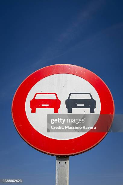 no overtaking sign and blue sky - overtaking stock pictures, royalty-free photos & images
