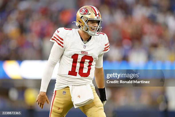 Mac Jones of the San Francisco 49ers reacts after throwing a touchdown pass during the second quarter against the Los Angeles Rams at SoFi Stadium on...